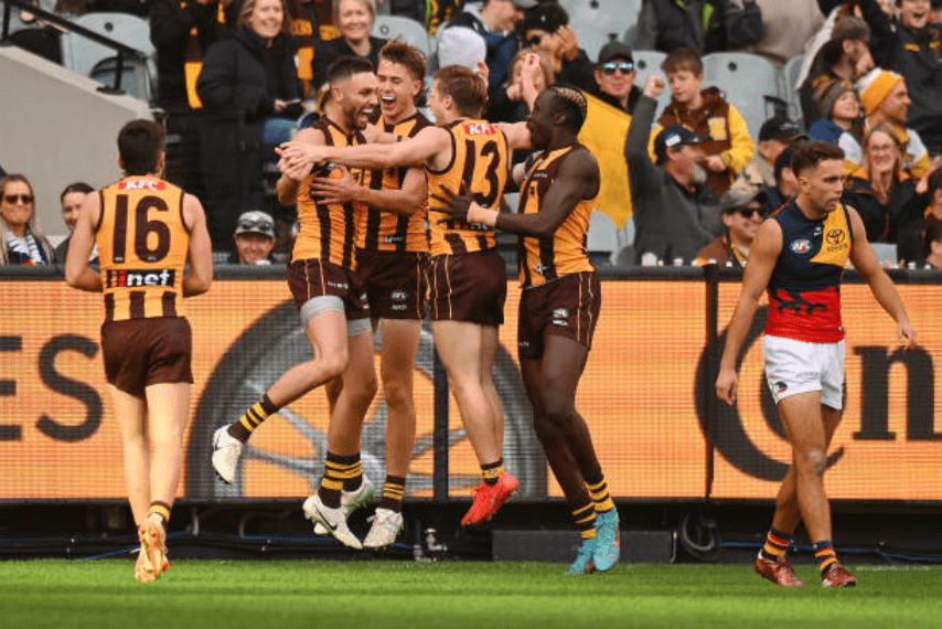 Jack Gunston celebrates one of three goals with some pumped up teammates - Photo Morgan Hancock via Getty Images