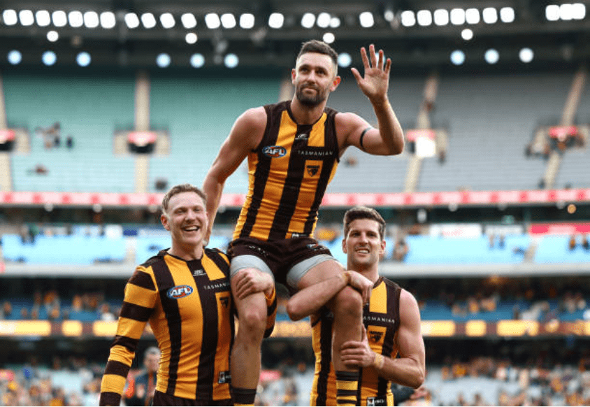 Jack Gunston chaired off in his 250th game - Photo Quinn Rooney via Getty Images