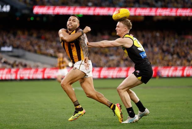 Jarman Impey with a difficult handball from his 21 disposals was solid off half back - Photo Michael Willson via Getty Images