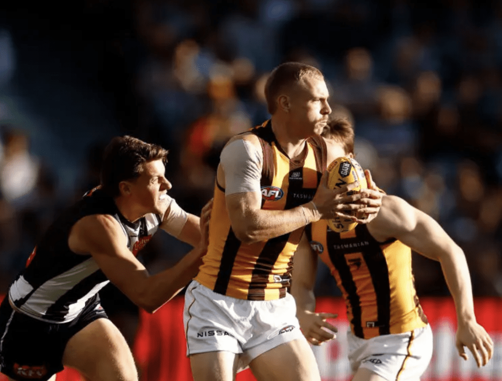 APRIL 07: James Worpel of the Hawks is tackled by Patrick Lipinski of the Magpies during the 2024 AFL Round 04 match between the Collingwood Magpies and the Hawthorn Hawks at Adelaide Oval on April 07, 2024 in Adelaide, Australia. (Photo by Michael Willson/AFL Photos via Getty Images)