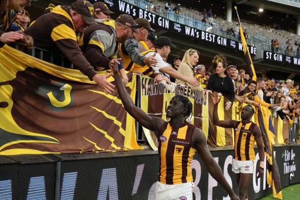 Changkuoth Jiath & Mabior Chol thank the Hawks fans - Photo Janelle St Pierre via Getty Images