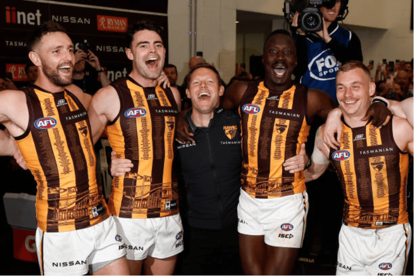 The Hawks belting out the team song after jumping into 8th place on the AFL ladder. Photo by Michael Willson | AFL Photos